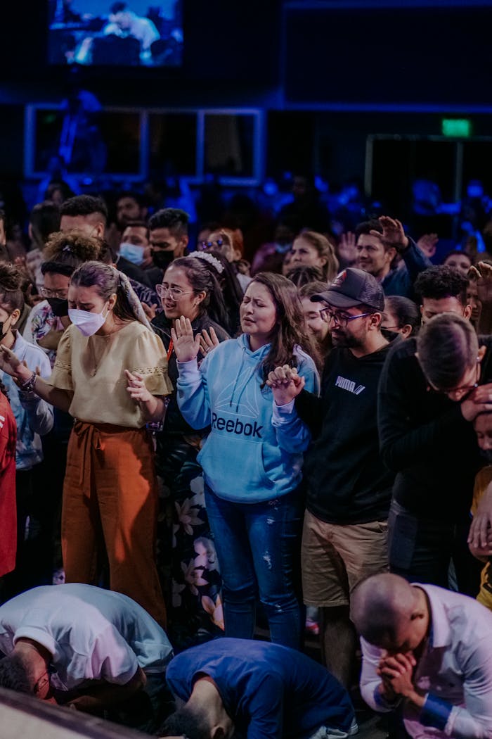 Mastering the First Impression: Your intriguing post title goes here Large congregation standing and praying together inside a church.