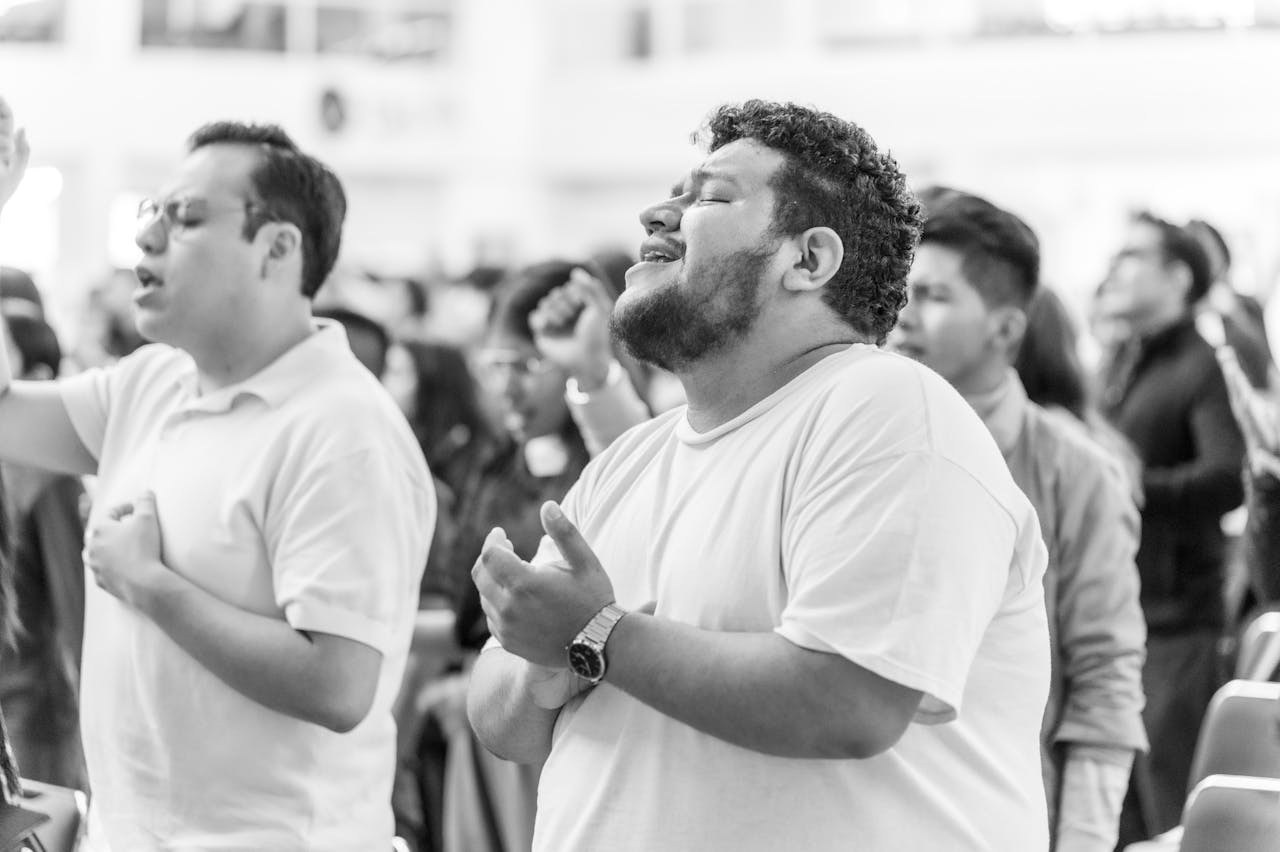 get-in-touch Adults in an uplifting worship session, embracing spirituality in Ciudad de México.