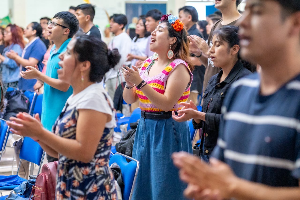 why-choose-us People passionately engaged in worship at a church in Ciudad de México, capturing cultural vibrancy.